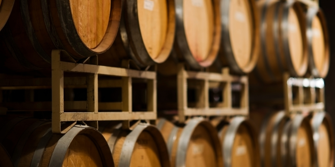 wine barrels on wooden pallets