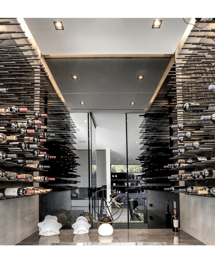 A full wall of cork-out bottles